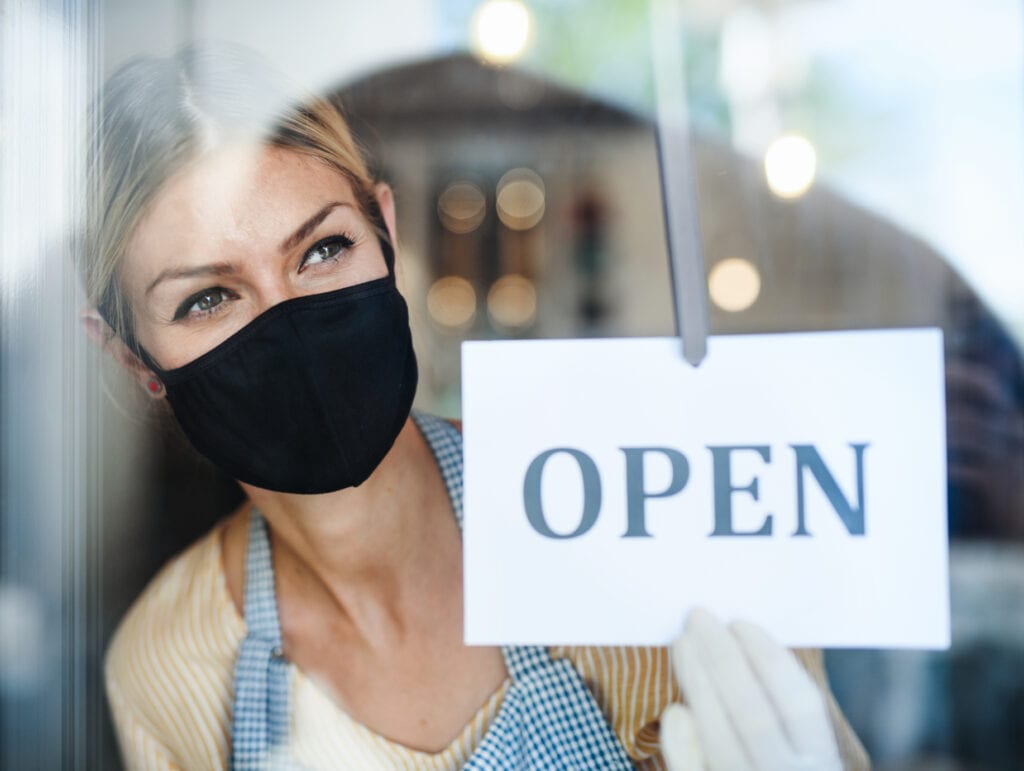 coffee-shop-woman-owner-with-face-mask-open-after--G7S4JDP